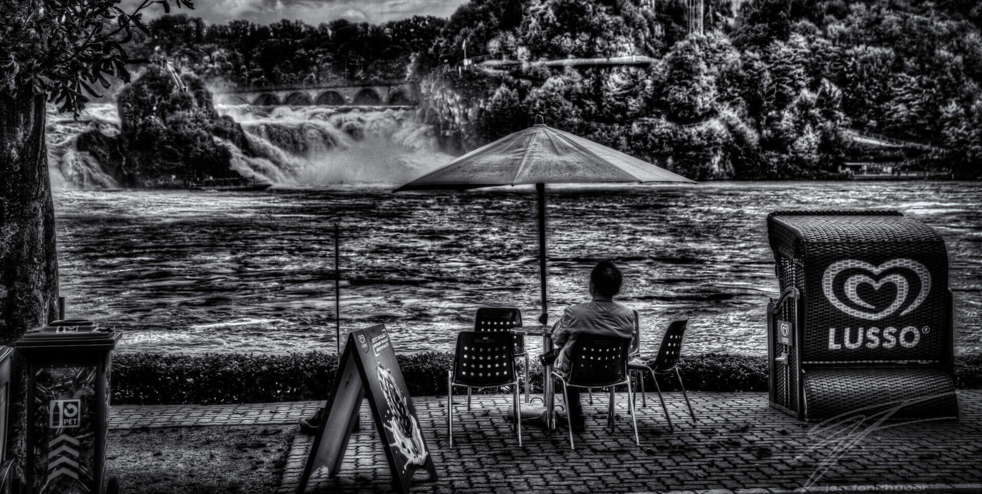 Watchin' the Falls A guy watching the Rheinfall in Shafhausen