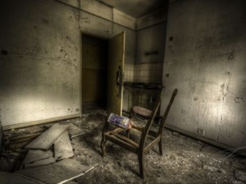 Lonely Chair in the CLinique du Diable, an abandoned sanatorium / hospital / hotel in Alsace, France